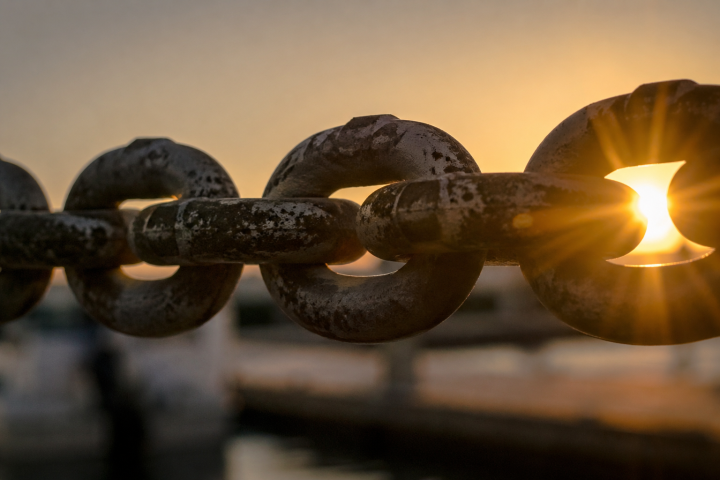 Steel chain links in afternoon sunshine
